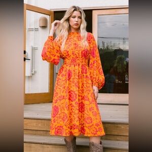 Bold Orange Dress with Pink Floral Design